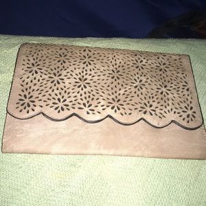 Tan clutch with petal pattern